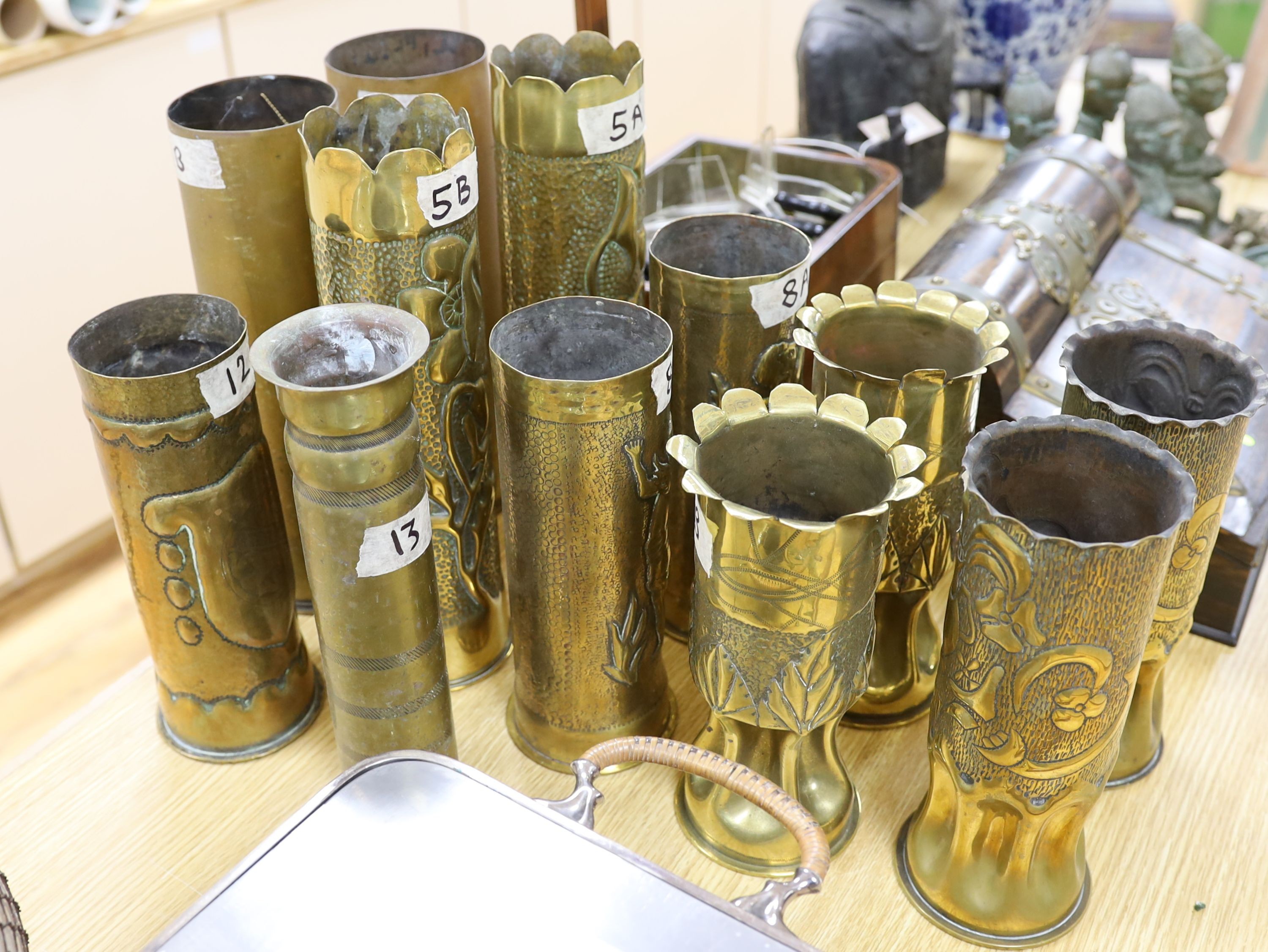 Collection of twelve WW1 trench art shell casings, tallest 31 cms high.